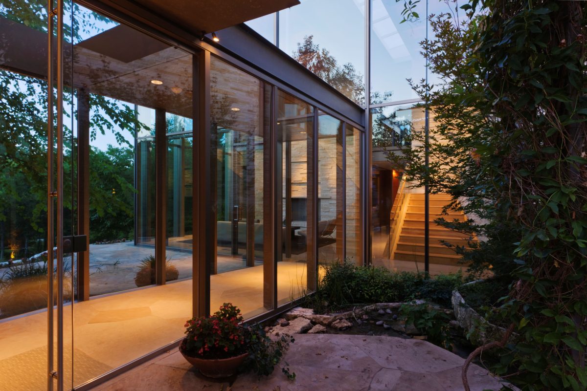 modern glass house blends with natural landscape 2026 03 25 02 15 18 utc
